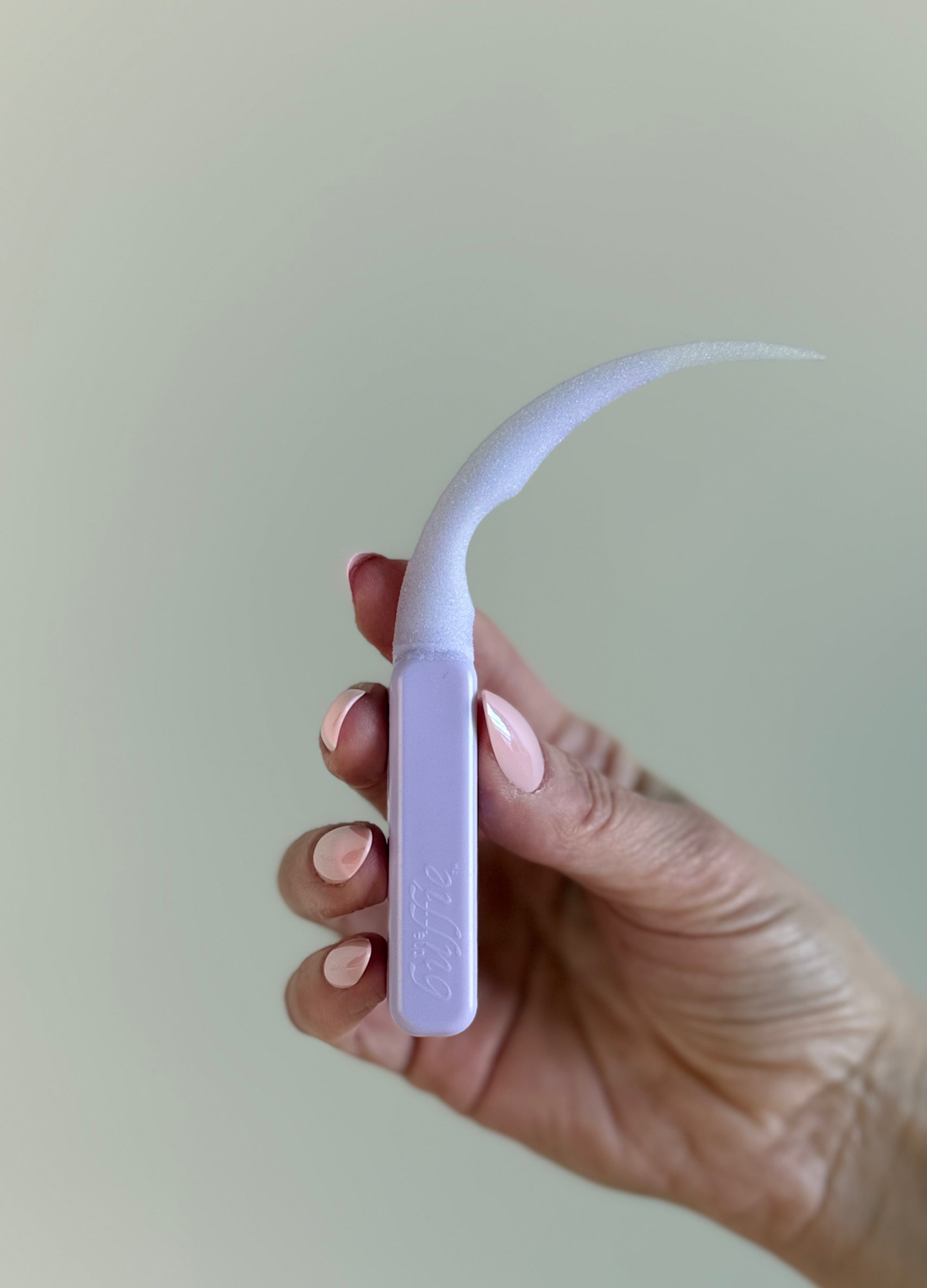 Easy way to refresh press-on nails using a nail care tool