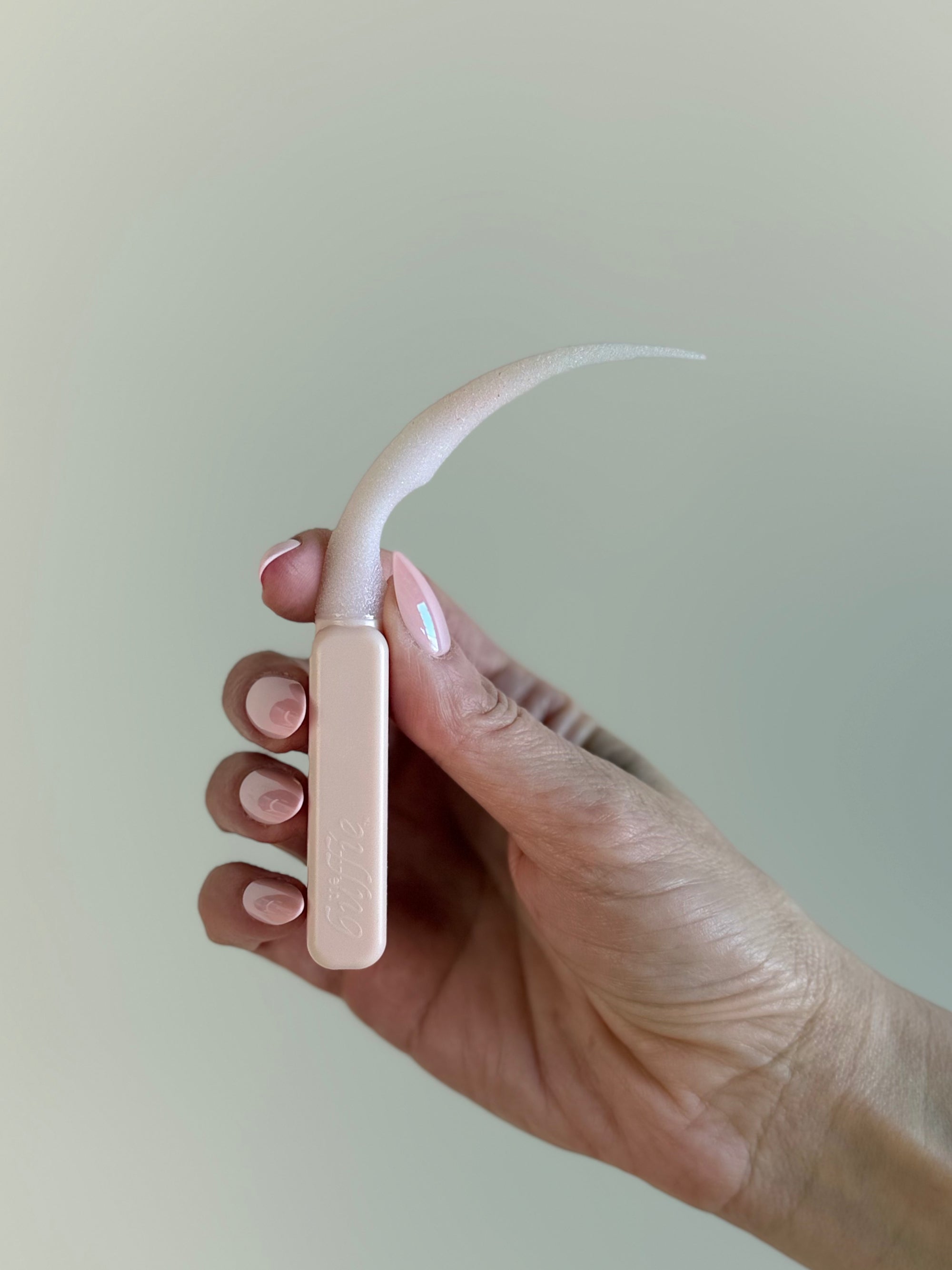 Flat lay of press-on nail tool in a clean and minimal beauty aesthetic